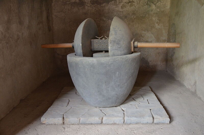 https://upload.wikimedia.org/wikipedia/commons/thumb/6/68/An_olive_crusher_displayed_in_the_House_of_the_Ship_Europa,_Pompeii_(14979550959).jpg/1600px-An_olive_crusher_displayed_in_the_House_of_the_Ship_Europa,_Pompeii_(14979550959).jpg